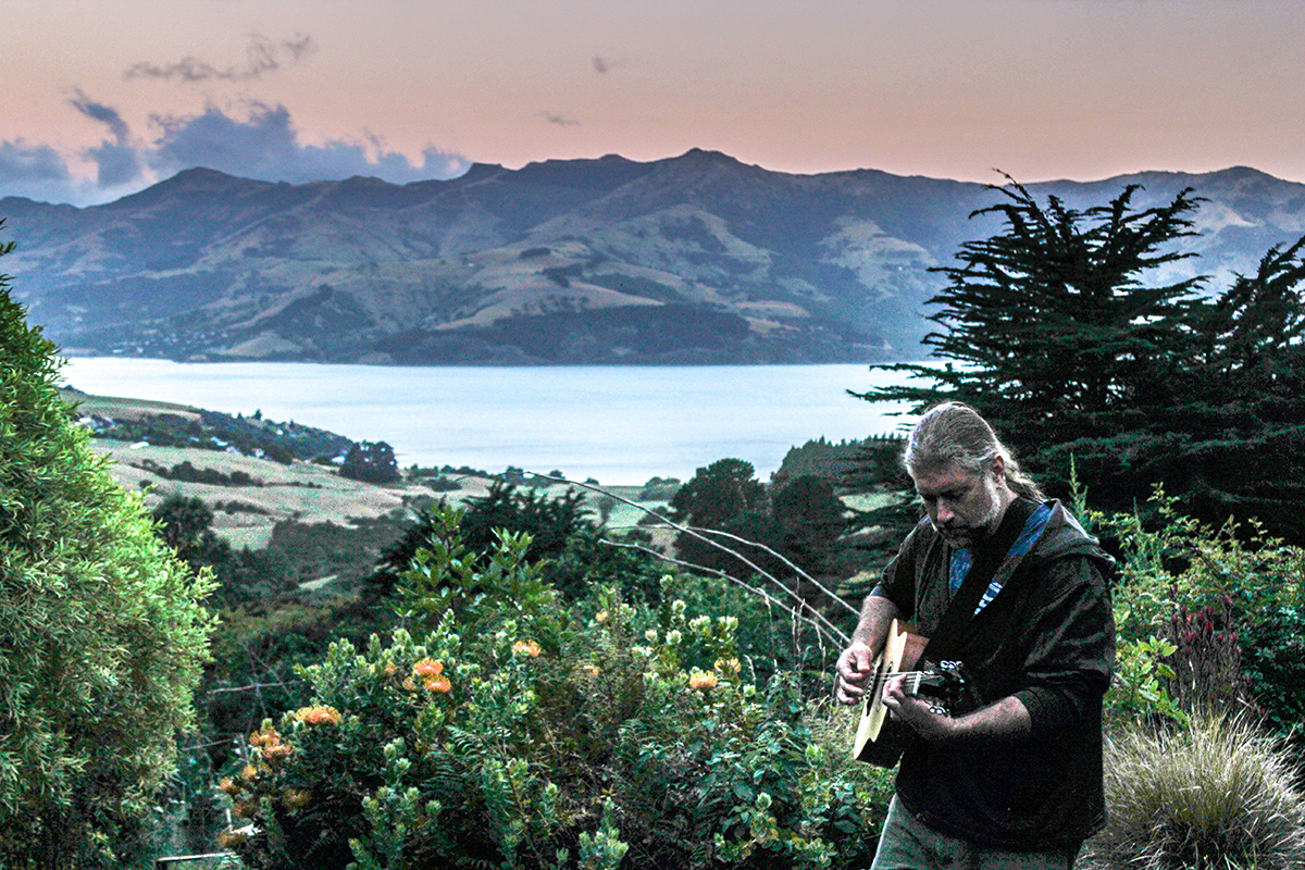 Tyler playing guitar in Akaroa, New Zealand. (Colin Tyler Bogucki)